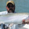 Angler Holding Giant Rainbow Trout
